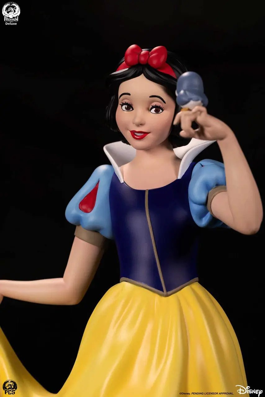 Snow White 1:5 scale statue Deluxe by Premium Collectibles Studio; blue bodice, yellow skirt, red bow.