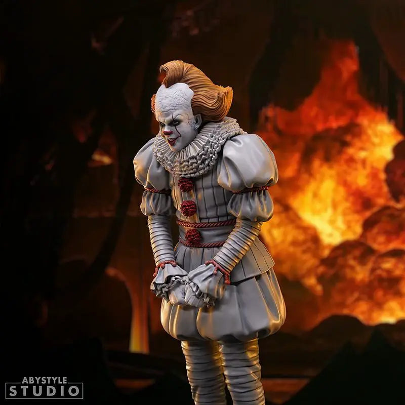 Pennywise 1/10 statue by ABYSTYLE STUDIO, gray-clad clown with ruffled collar against fiery backdrop.