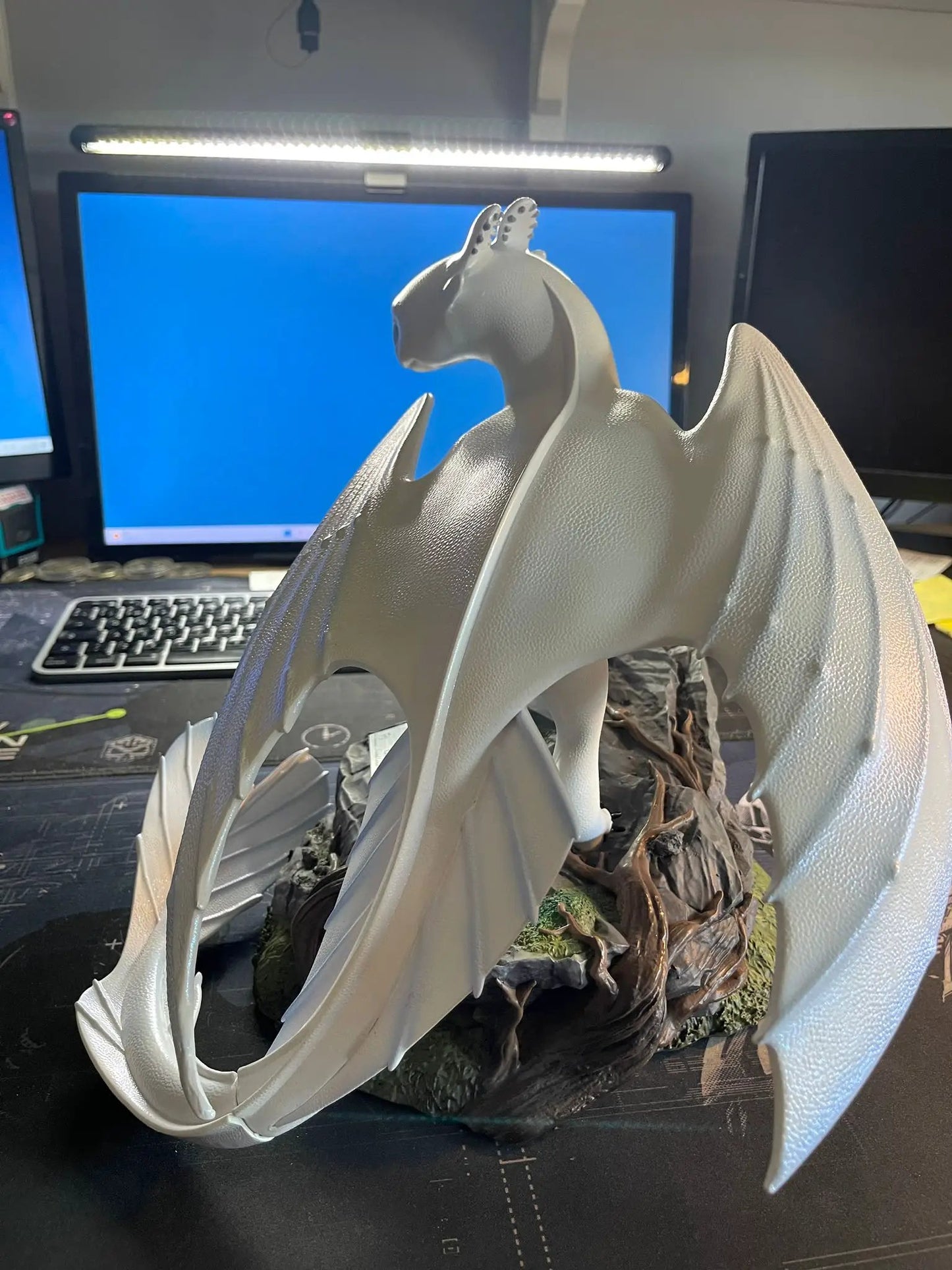 How to Train Your Dragon 3 Light Fury Master Craft dragon figure by BEAST KINGDOM in gray with wings spread.