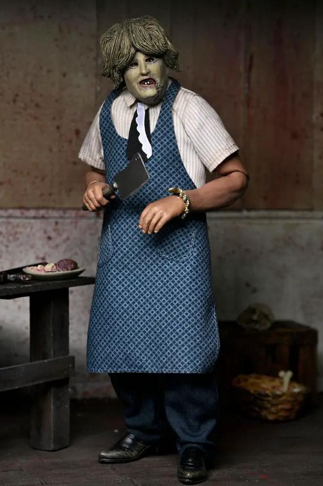 Leatherface action figure, 20 cm, wearing old-lady mask and blue patterned apron, holding a meat cleaver.