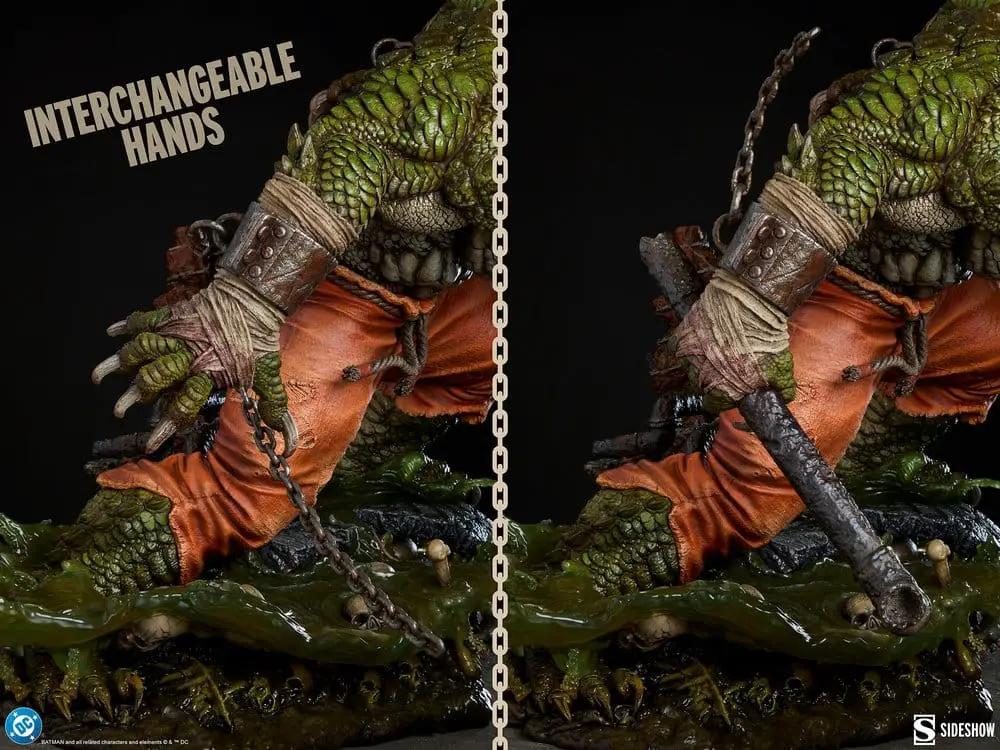 DC Comics Killer Croc statue by Sideshow Collectibles; green scaly figure in orange pants with interchangeable hands.