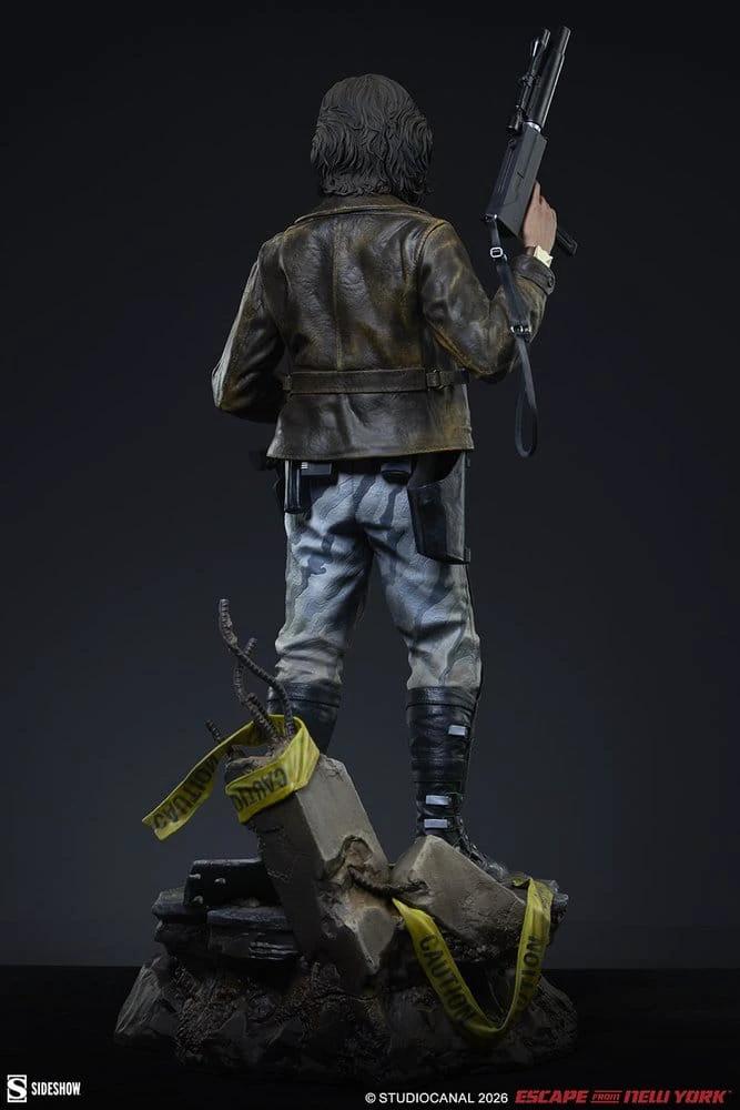 Snake Plissken Premium Format statue by Sideshow Collectibles; back view of 57cm figure in leather jacket and camo pants.