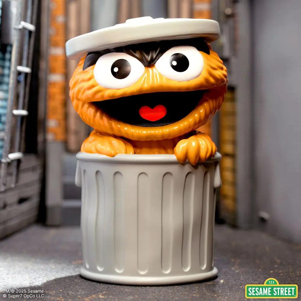 Oscar the Grouch orange soft vinyl action figure by Super7 in a trash can, 13 cm tall, Sesame Street.
