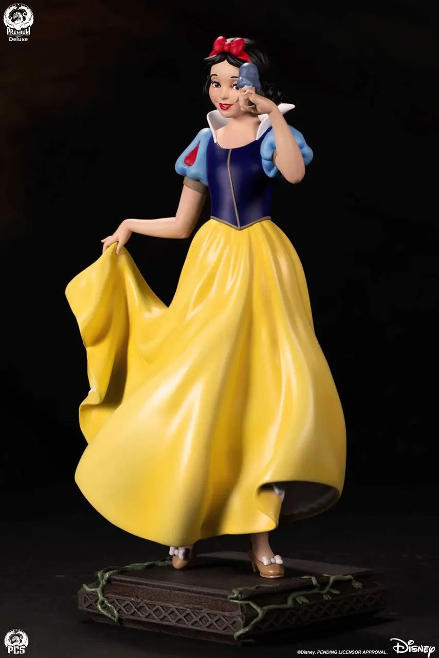 Snow White 1:5 scale deluxe statue by Premium Collectibles Studio; yellow gown, blue bodice, red bow, blue apple.