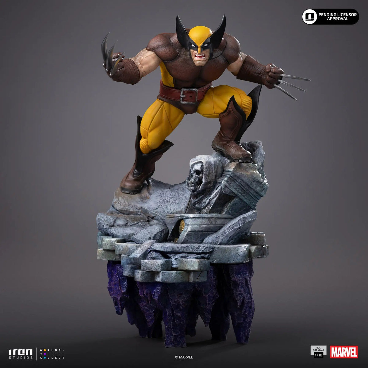 Wolverine statue by Iron Studios, 1/10 scale, yellow-brown suit, dynamic clawed pose on rocky pedestal