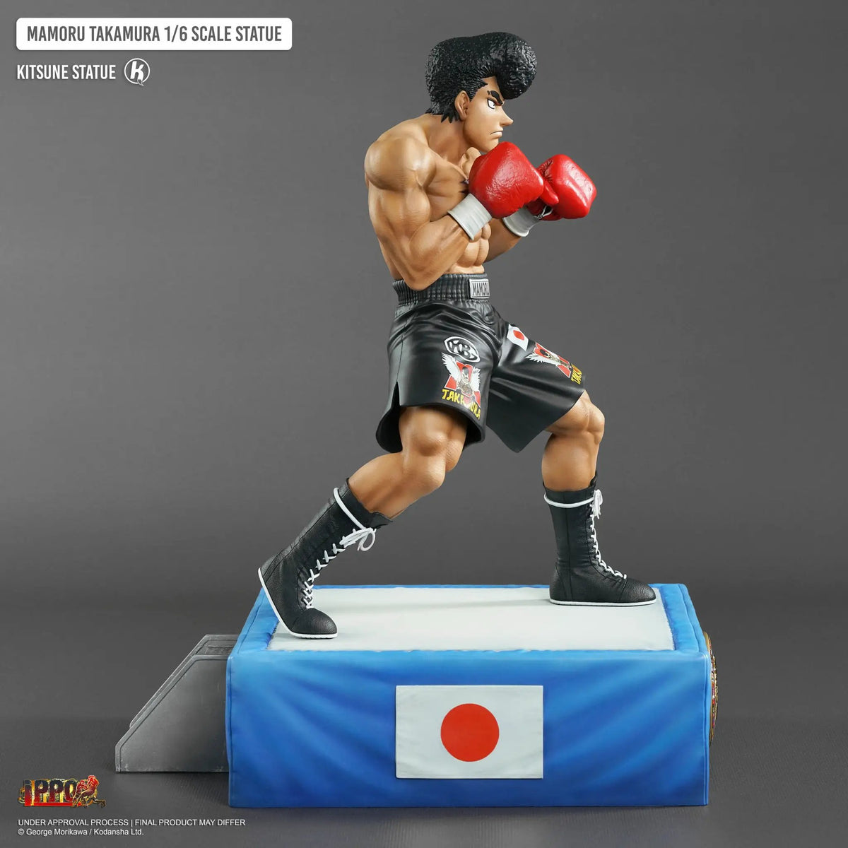 Takamura 1/6 Kitsune statue with red boxing gloves on a blue display base.