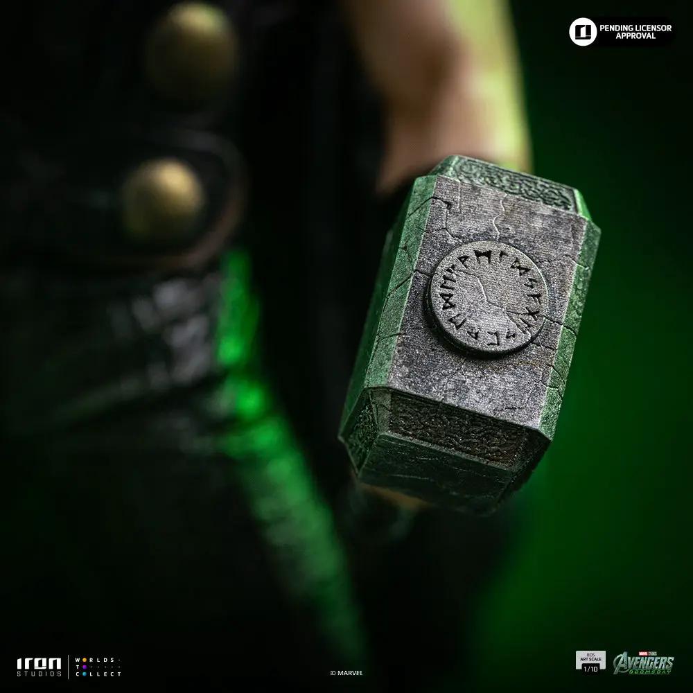 Statue Thor Mjolnir close-up; weathered gray hammer head with rune circle, green glow background, Iron Studios 1/10 scale