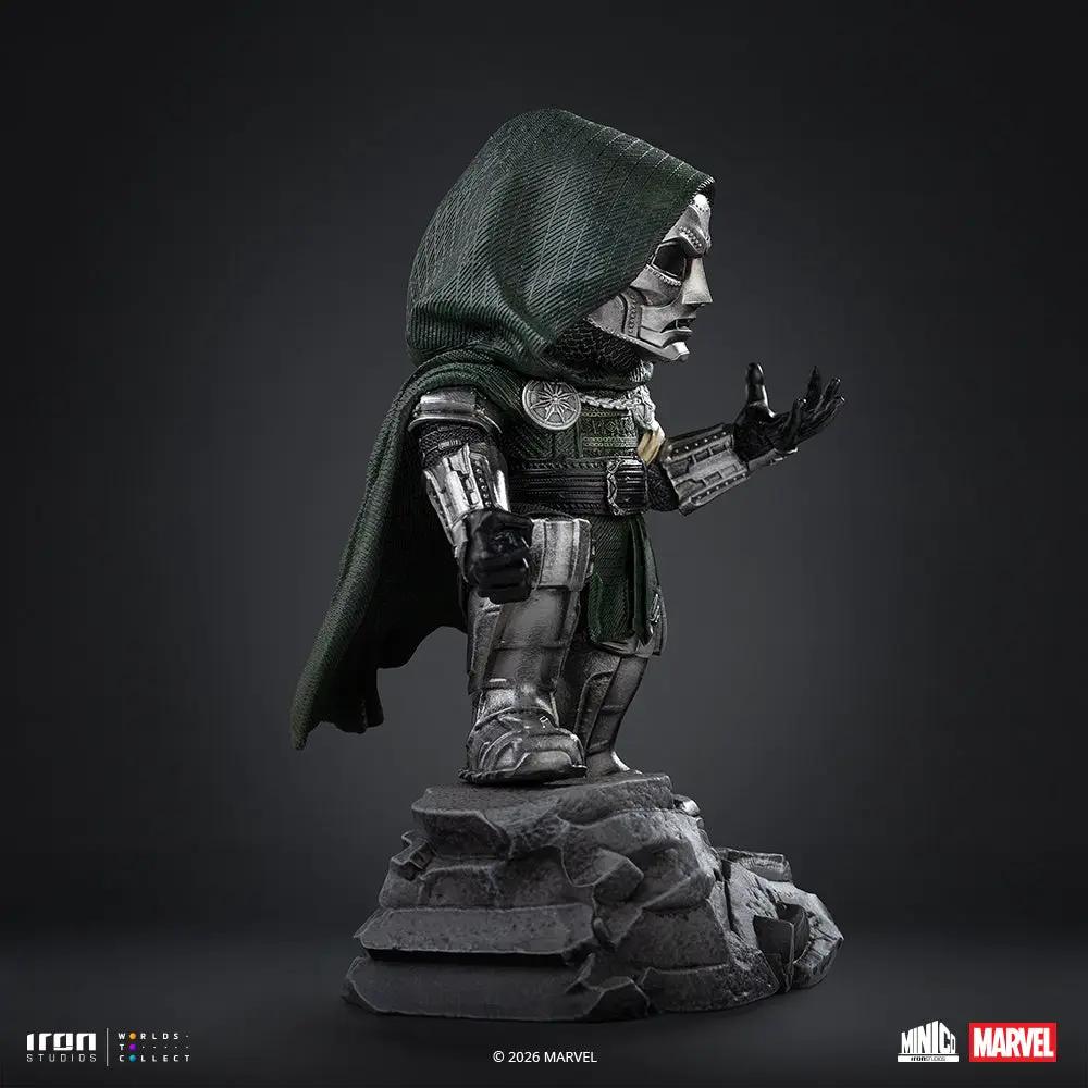 Statue Doctor Doom Minico by Iron Studios in green cloak and silver armor on a rocky pedestal
