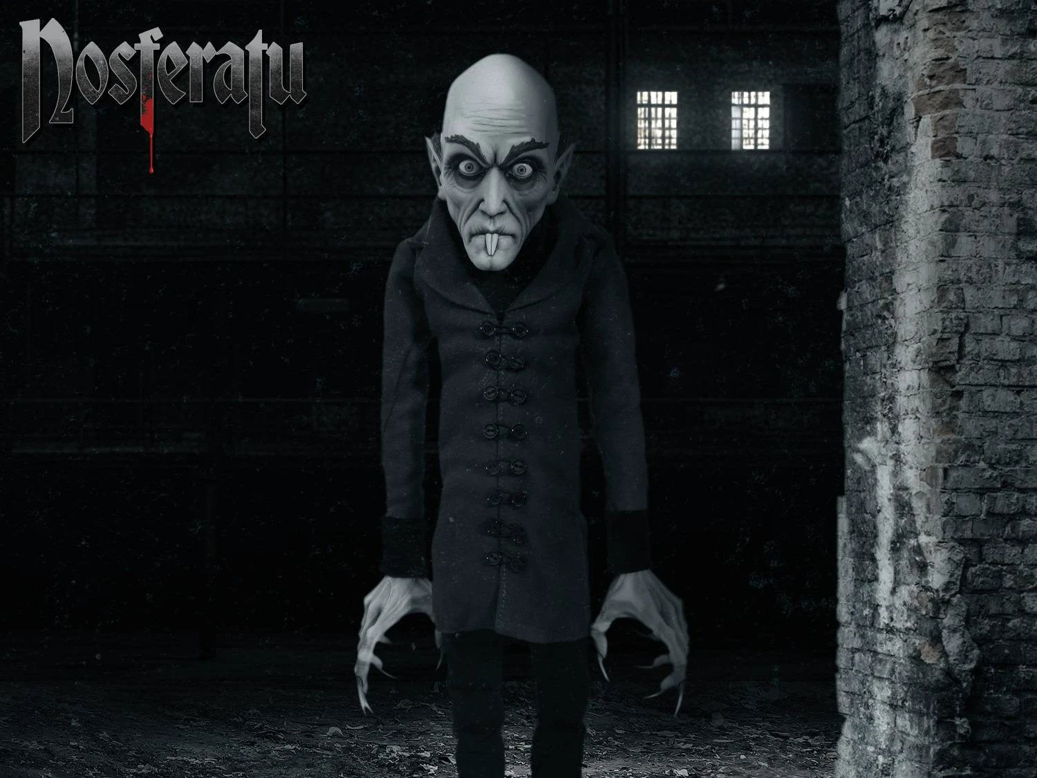 Nosferatu Mds Roto Plush 45 cm plush toy by Mezco Toys, grey-skinned vampire in a black coat.