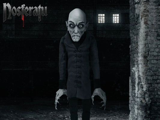 Nosferatu Mds Roto Plush 45 cm plush toy by Mezco Toys, grey-skinned vampire in a black coat.