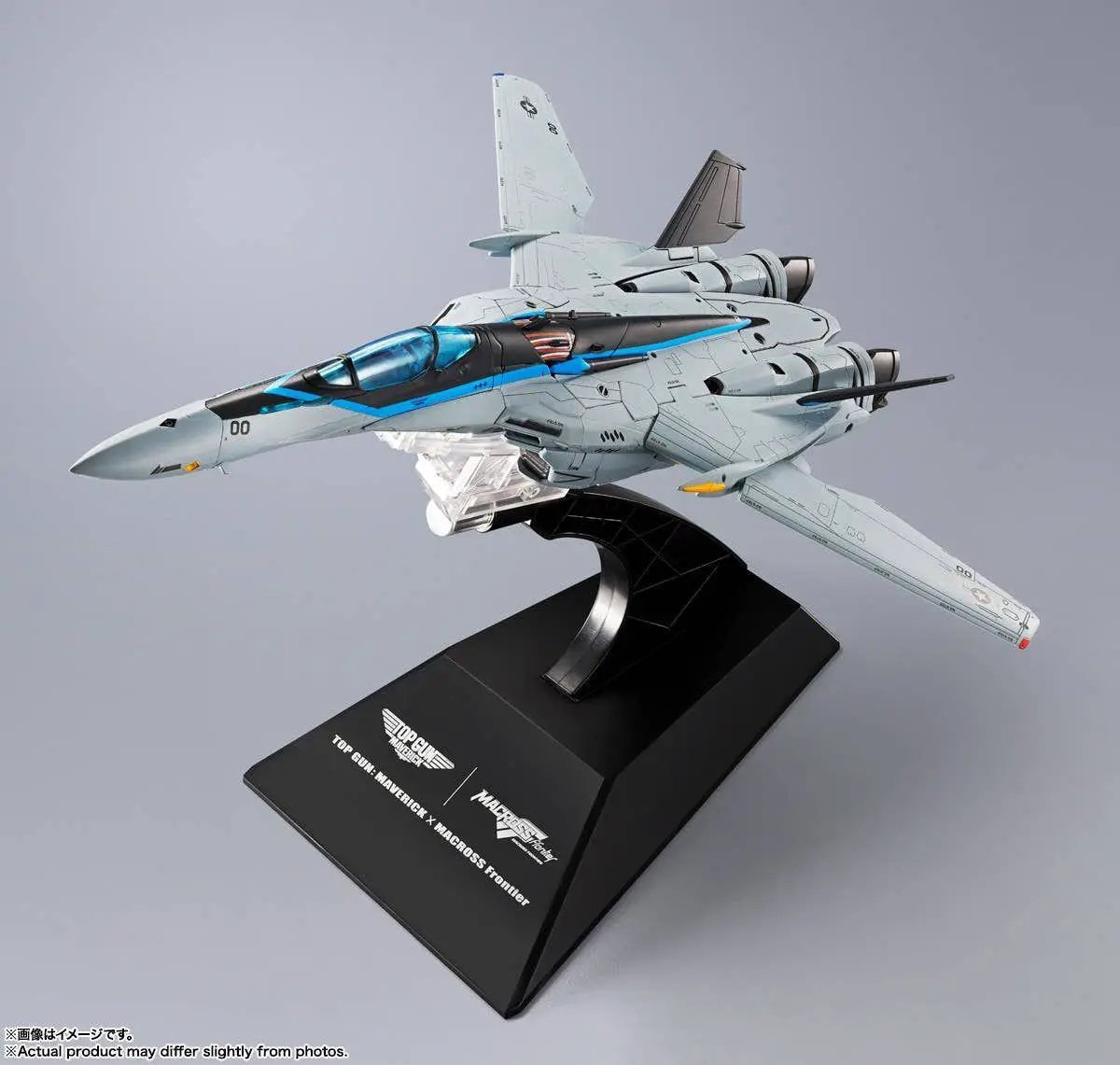 DX Chogokin Macross VF-25 Messiah Valkyrie Top Gun Maverick model aircraft by Bandai, light gray with blue cockpit