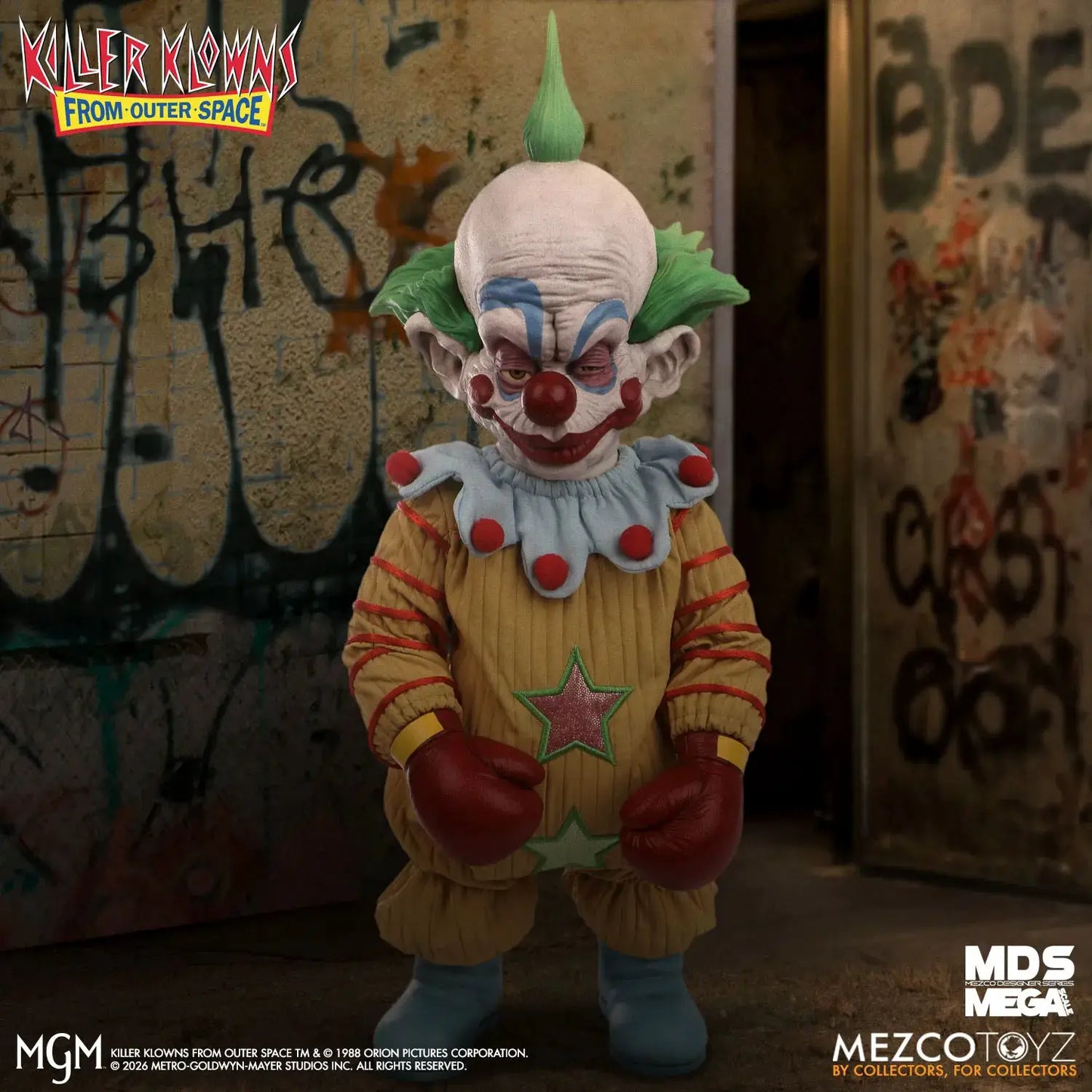 Mezco Toys Killer Klowns From Outer Space Shorty MDS Mega Scale clown figure in a yellow jumpsuit with red gloves