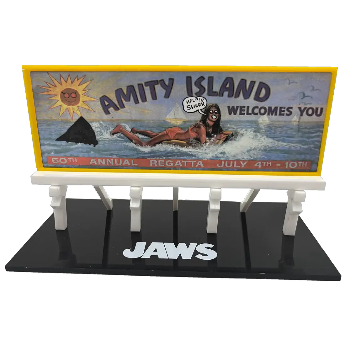Jaws Amity Island Billboard Prop Replica by Factory Entertainment on a yellow-framed billboard with black display base