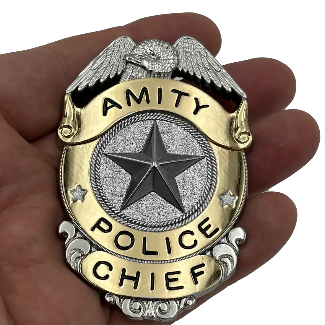 Jaws Amity Island Police Chief badge prop replica in gold and silver finish with winged eagle.