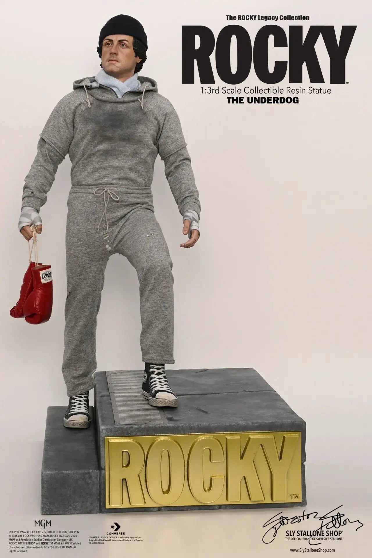 Rocky 1:3 scale resin statue in gray sweats, black beanie, red glove on pedestal by SLYSTALLONESHOP