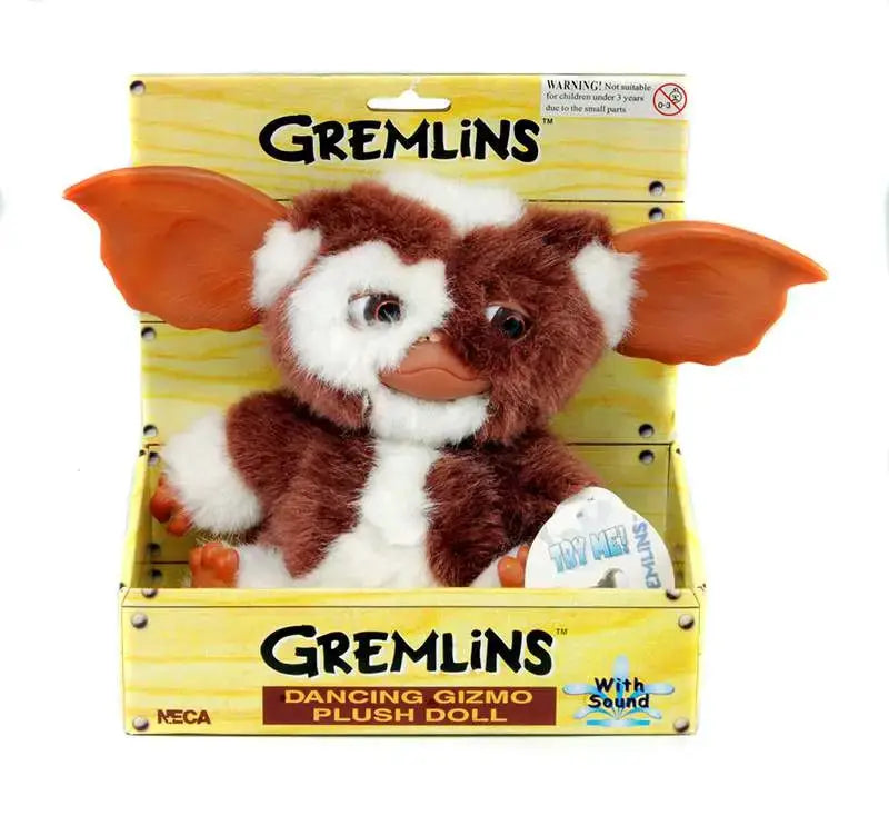 Gremlins Gizmo Dancing Plush Doll by NECA, brown and white fur with orange ears in a yellow display box