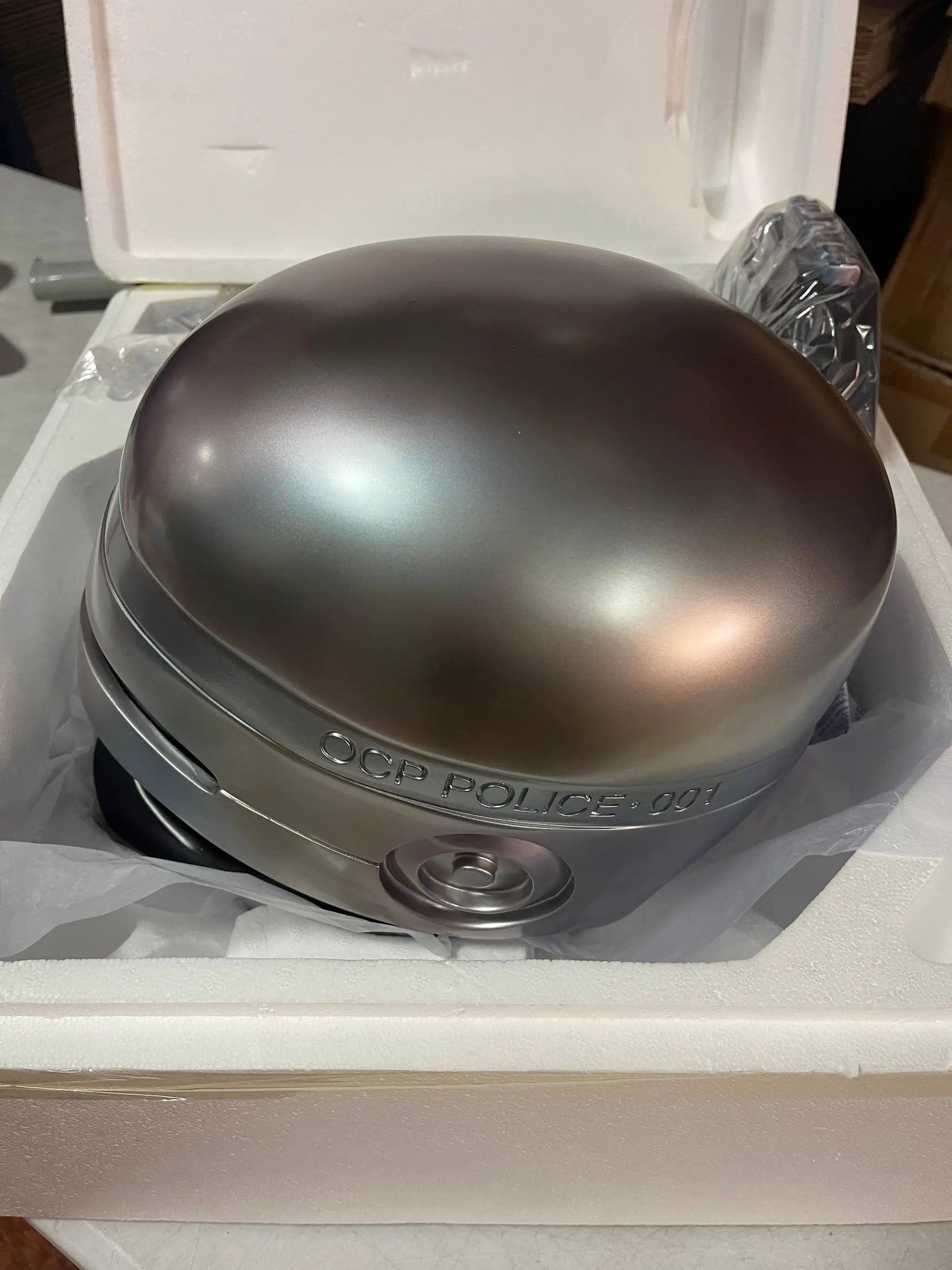 RoboCop helmet replica 1:1 scale in metallic silver with OCP POLICE inscription, Hollywood Collectables