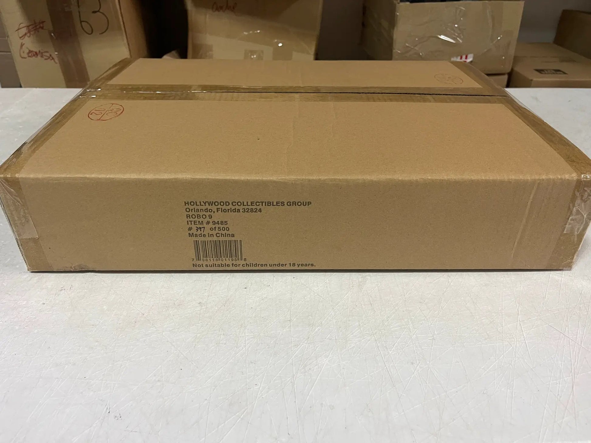 RoboCop replica packaging from Hollywood Collectibles Group; brown cardboard box with product label.