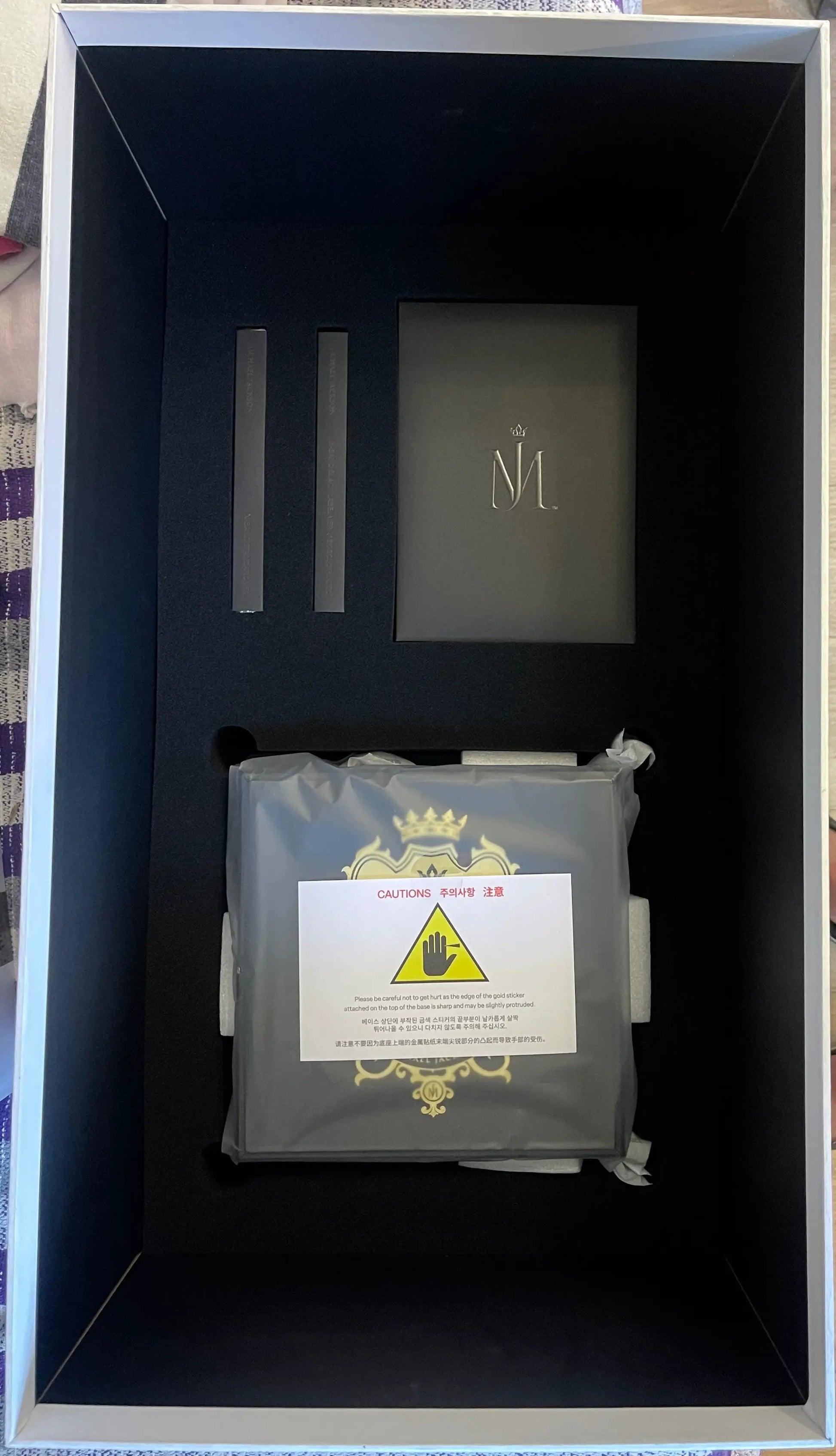 Michael Jackson Black Label 1/4 Scale Statue packaging; black interior foam with two slots and a booklet with M emblem