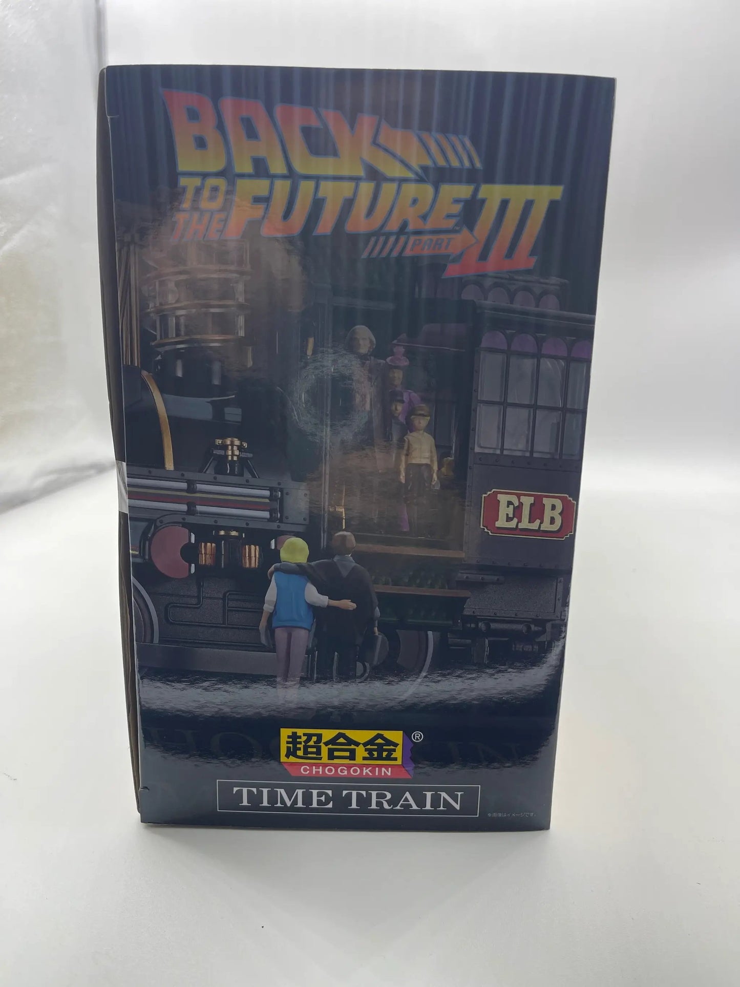 Back To The Future Time Train Chogokin figure box by Bandai; blue packaging with ELB logo and group of figurines.