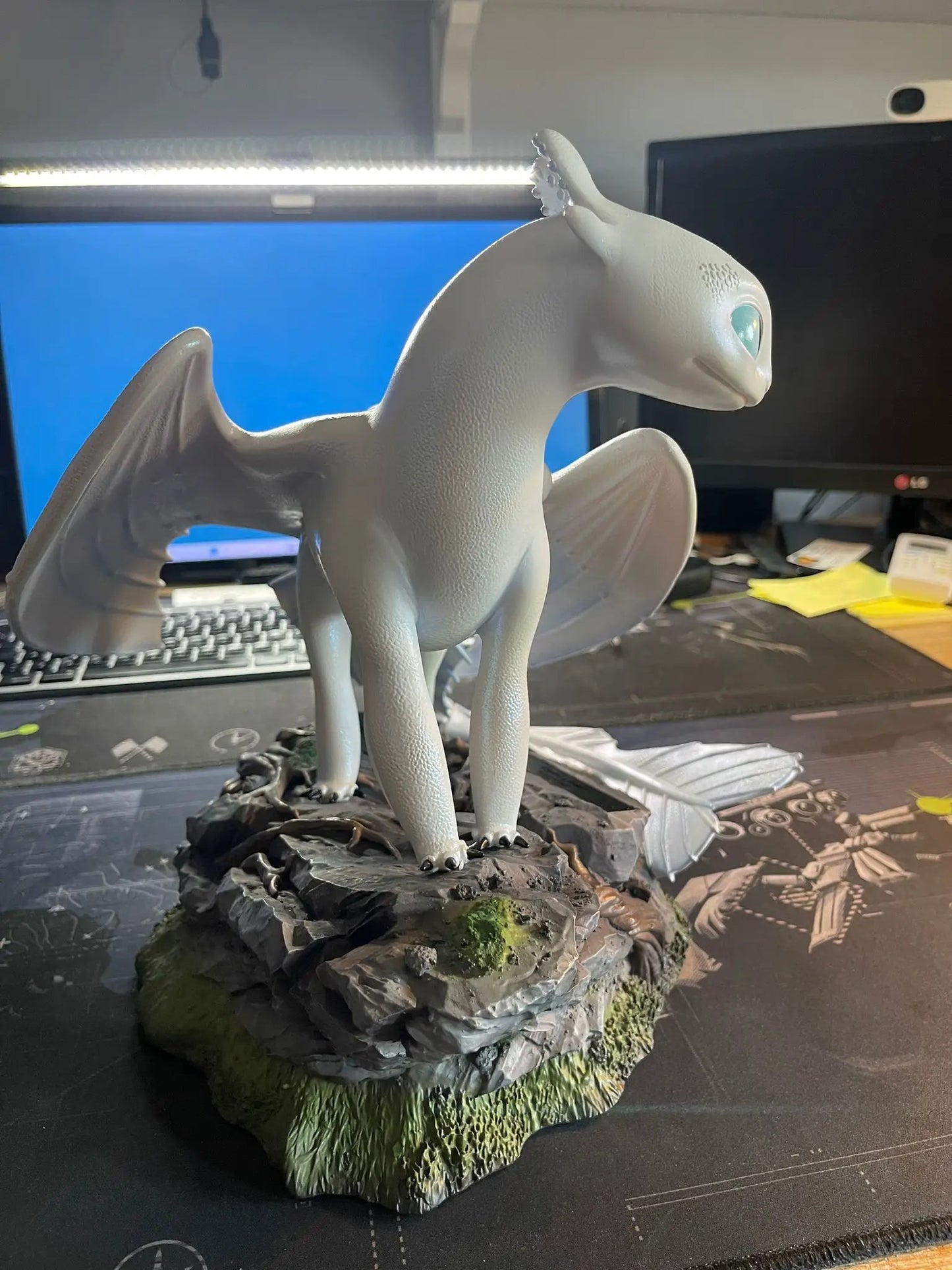 Light Fury Master Craft dragon figure by BEAST KINGDOM on gray rocky pedestal