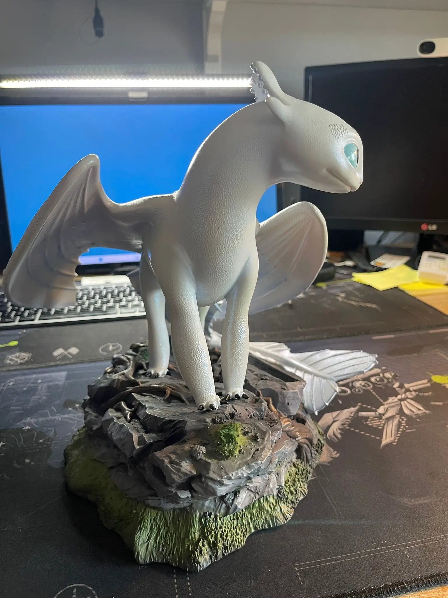 Light Fury Master Craft dragon figure by BEAST KINGDOM on gray rocky pedestal
