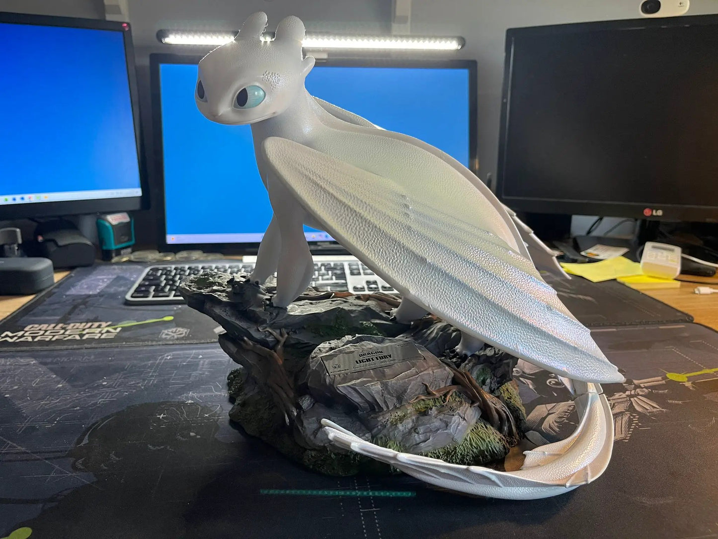 Beast Kingdom How to Train Your Dragon 3 Light Fury Master Craft figure with a white dragon on a rocky base