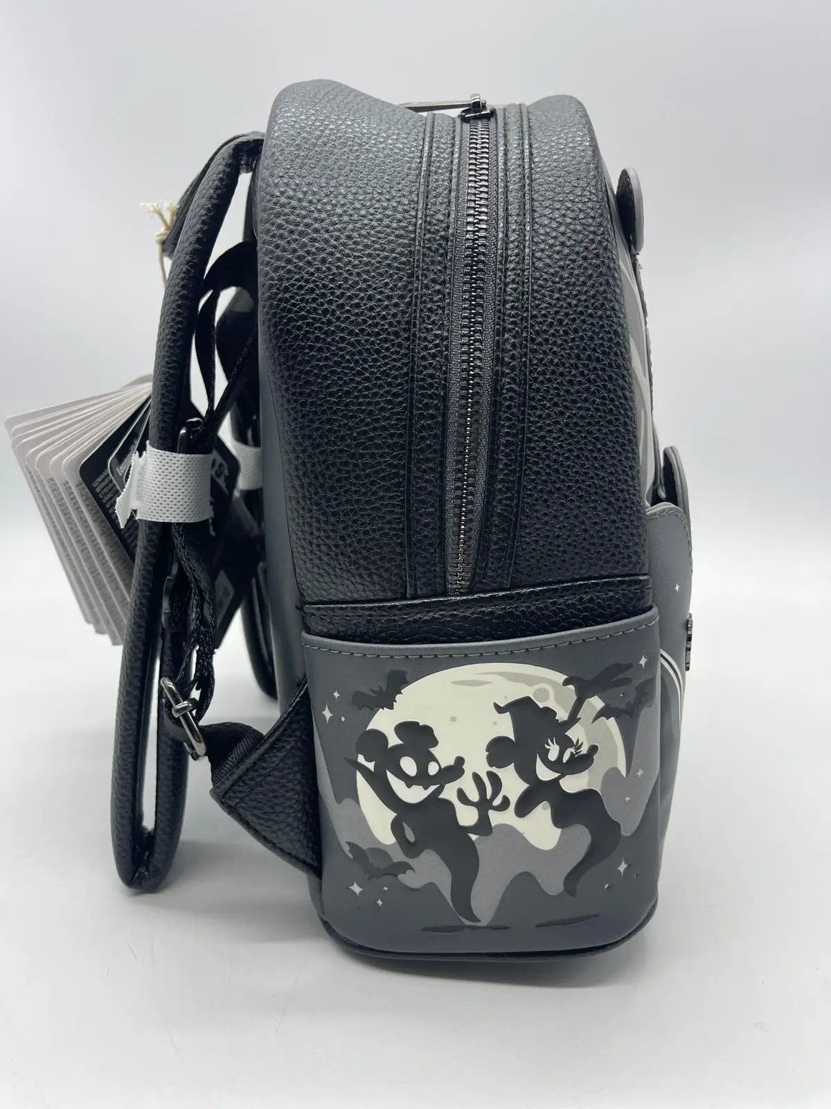 LOUNGEFLY Mickey & Minnie mini ghost light-up backpack with gray moon silhouette panel.