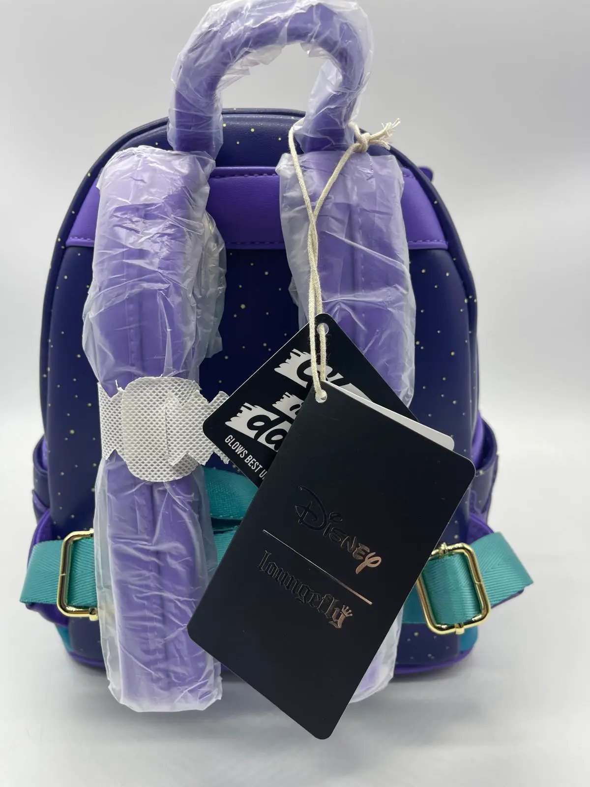 Pato Darkwing Loungefly Mochila Mini backpack in purple and navy with teal strap.