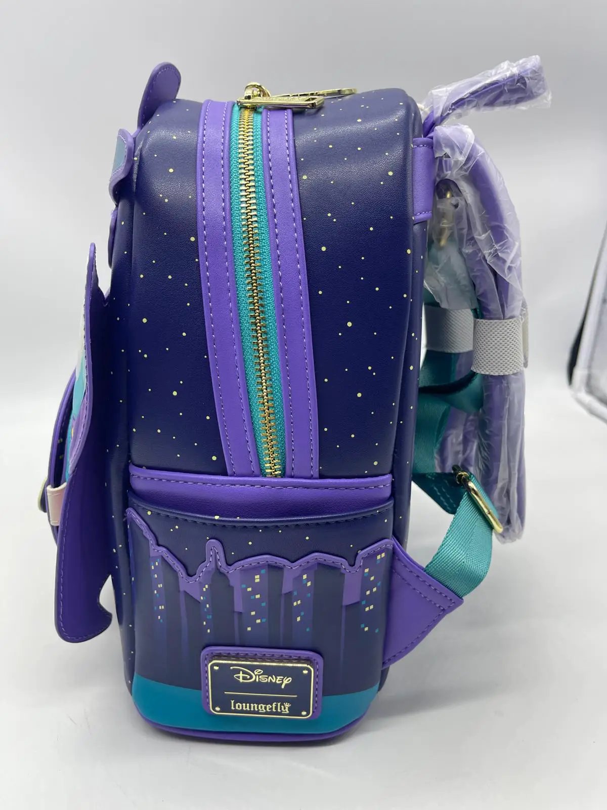 Pato Darkwing Loungefly mini backpack; purple with teal zipper, gold teeth, and Disney/Loungefly badge
