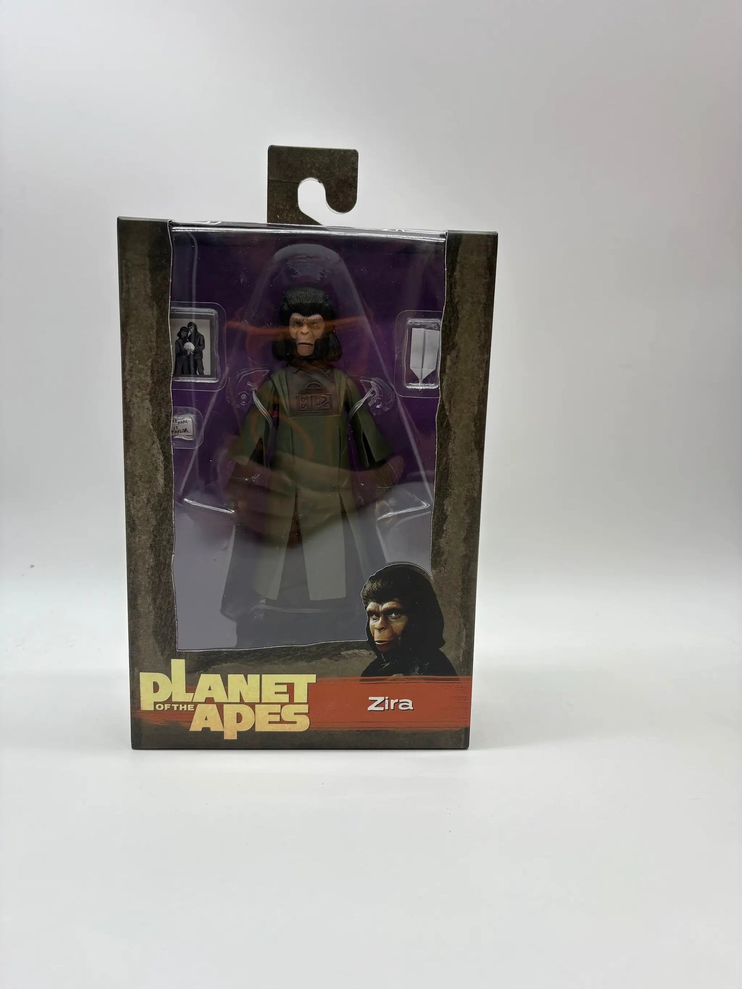 NECA Planet of the Apes Zira action figure, 18 cm, in windowed purple packaging.