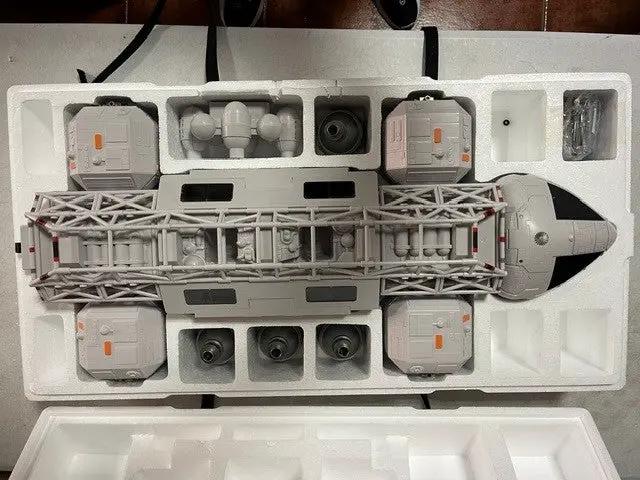 Space 1999 Eagle transporter model by ZICA TOYS, gray with orange accents in styrofoam packaging.