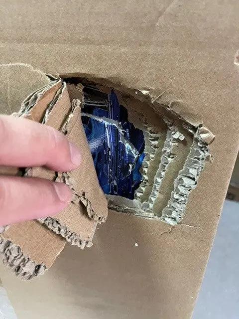 Space 1999 Eagle 1976 retro playset by ZICA TOYS, blue plastic parts visible behind torn packaging.