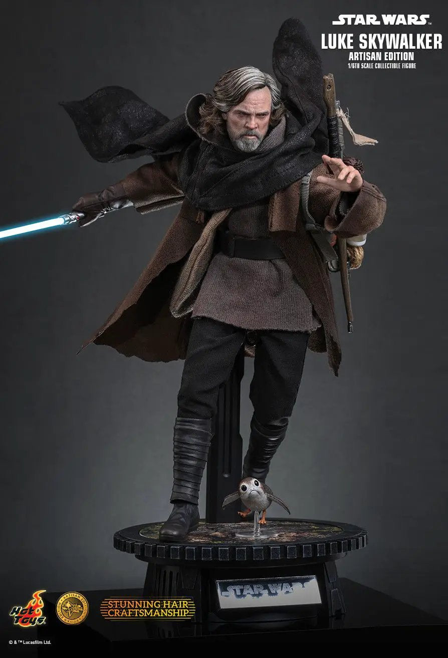 Star Wars Luke Skywalker Artisan Edition 1/6-scale action figure by HOT TOYS with brown cloak and blue lightsaber