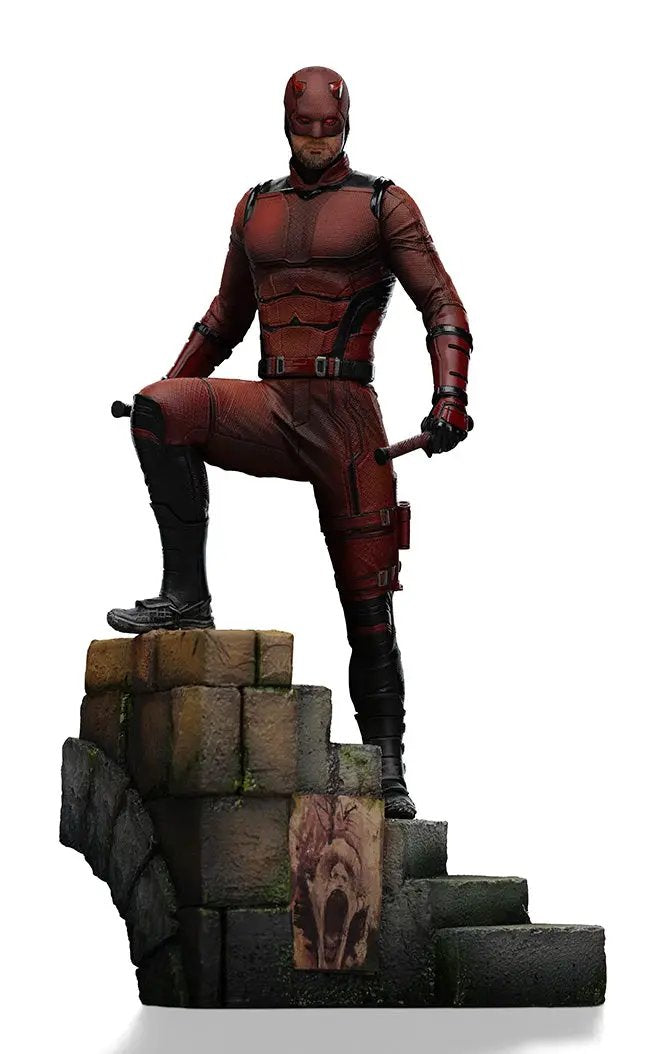 Statue Daredevil by Iron Studios from Daredevil: Born Again, Art Scale 1/10, red armored hero on a stone ruin.