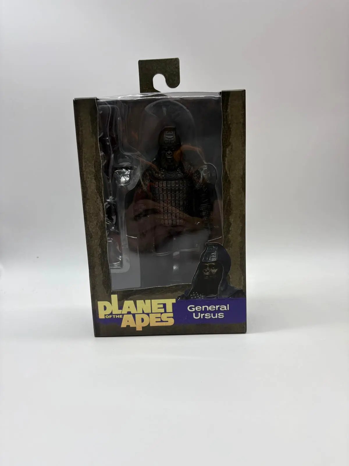General Ursus action figure from Planet of the Apes, 18 cm, in dark armored suit inside window packaging
