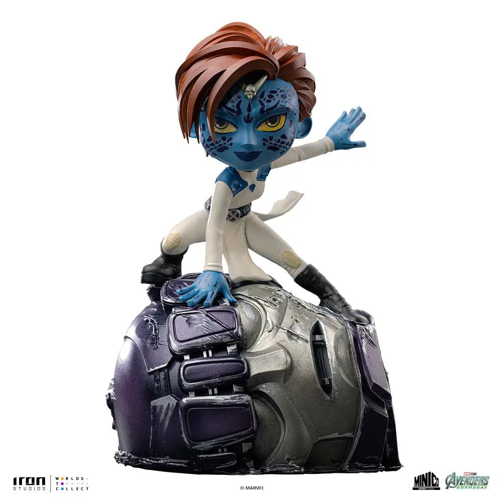 Statue Mystique Minico by Iron Studios; blue-skinned X-Men figure in white suit perched on damaged metallic base.