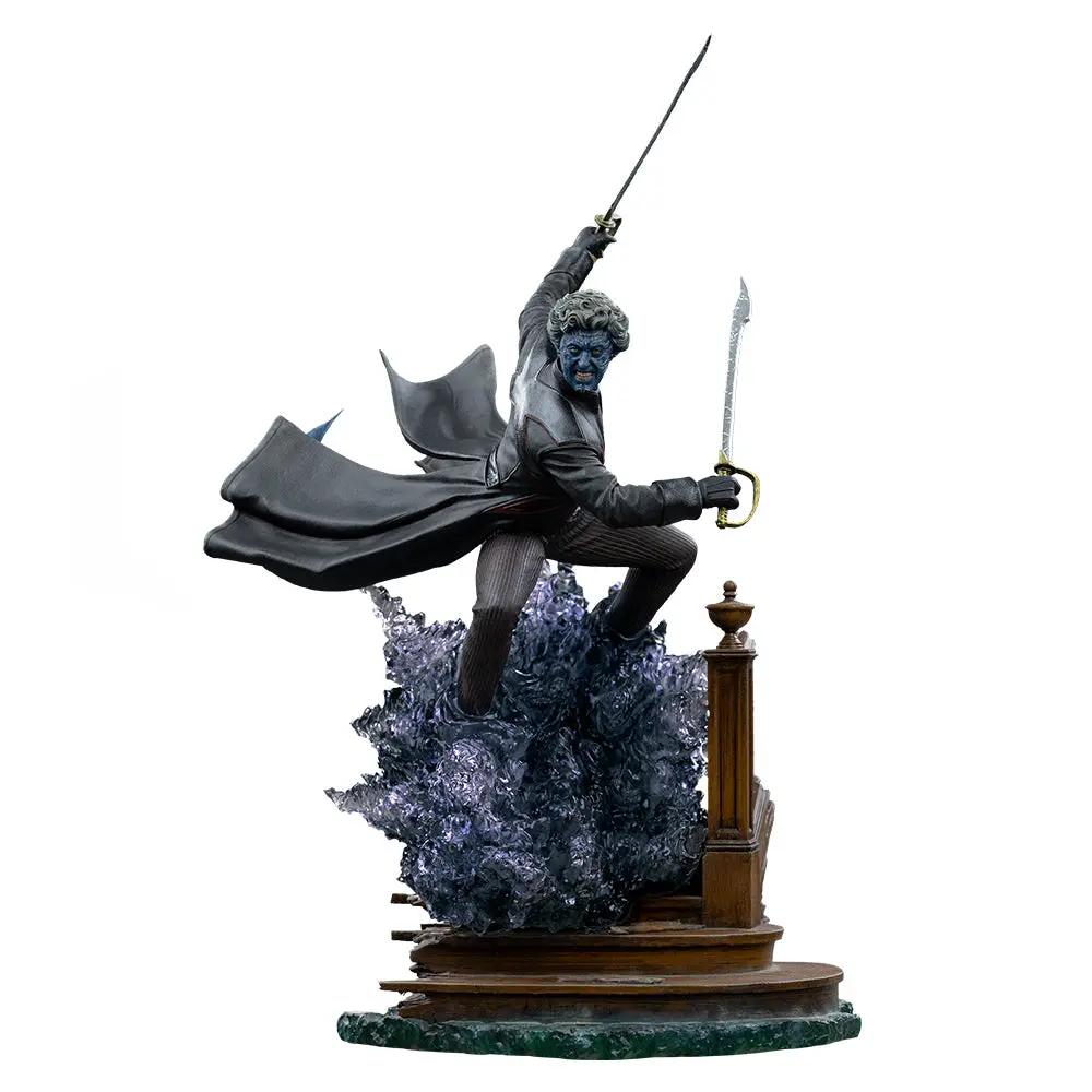 Statue Nightcrawler by Iron Studios; blue-skinned figure in gray coat wielding dual swords atop a pedestal with purple base.