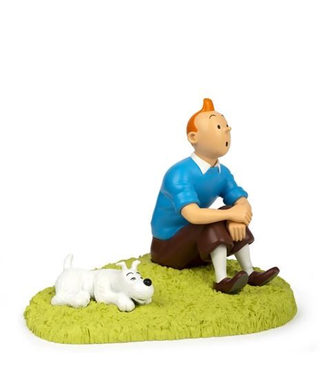 Figura de coleccíon de resina Tintin sentado en la hierba