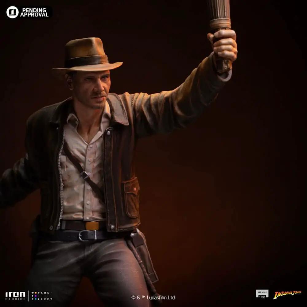 Indiana Jones statue by Iron Studios, 1/10 scale, in brown leather jacket and fedora, raising a torch.