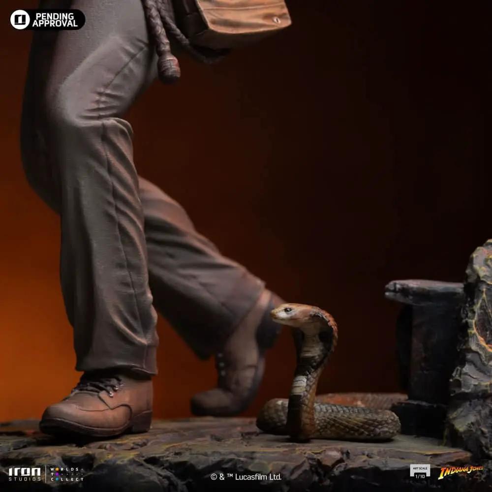 Indiana Jones statue 1/10 scale by Iron Studios with cobra at its feet on a rocky base