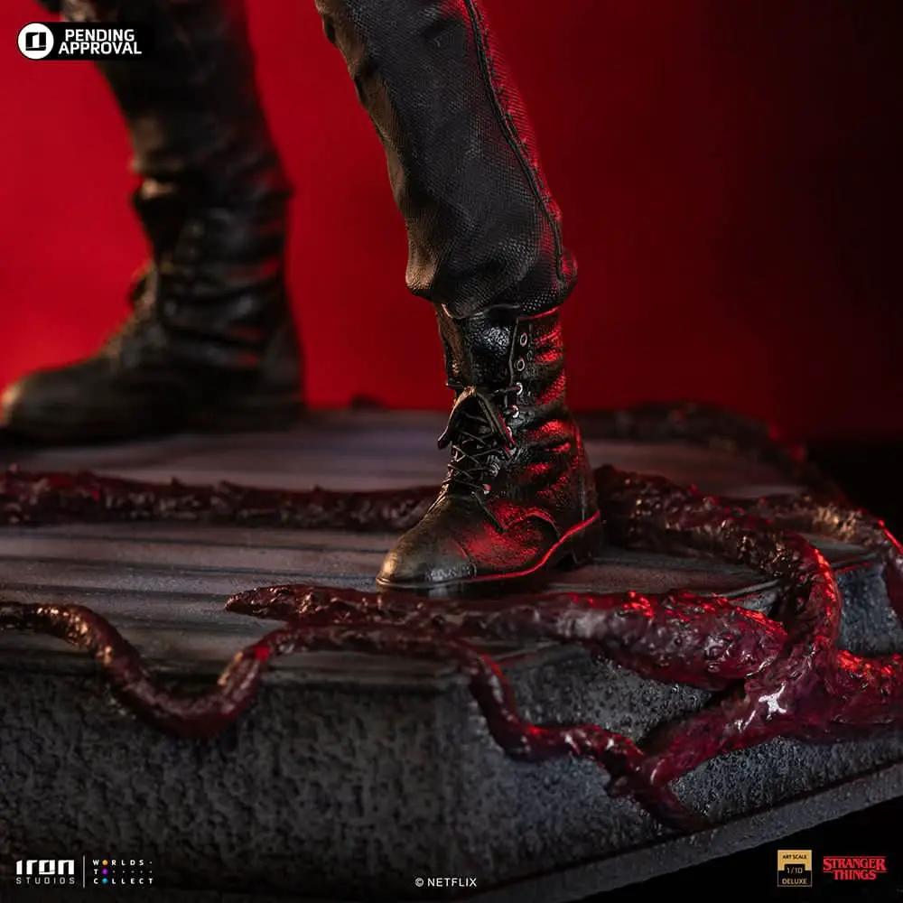 Statue Eddie from Stranger Things by Iron Studios, Art Scale 1/10, boots on a textured base with red lighting