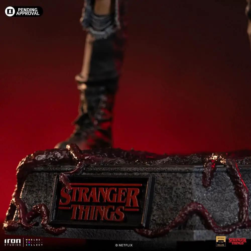 Statue Eddie from Stranger Things by Iron Studios; 1/10 scale action figure on a textured base with red tendrils and Stranger Things plaque.