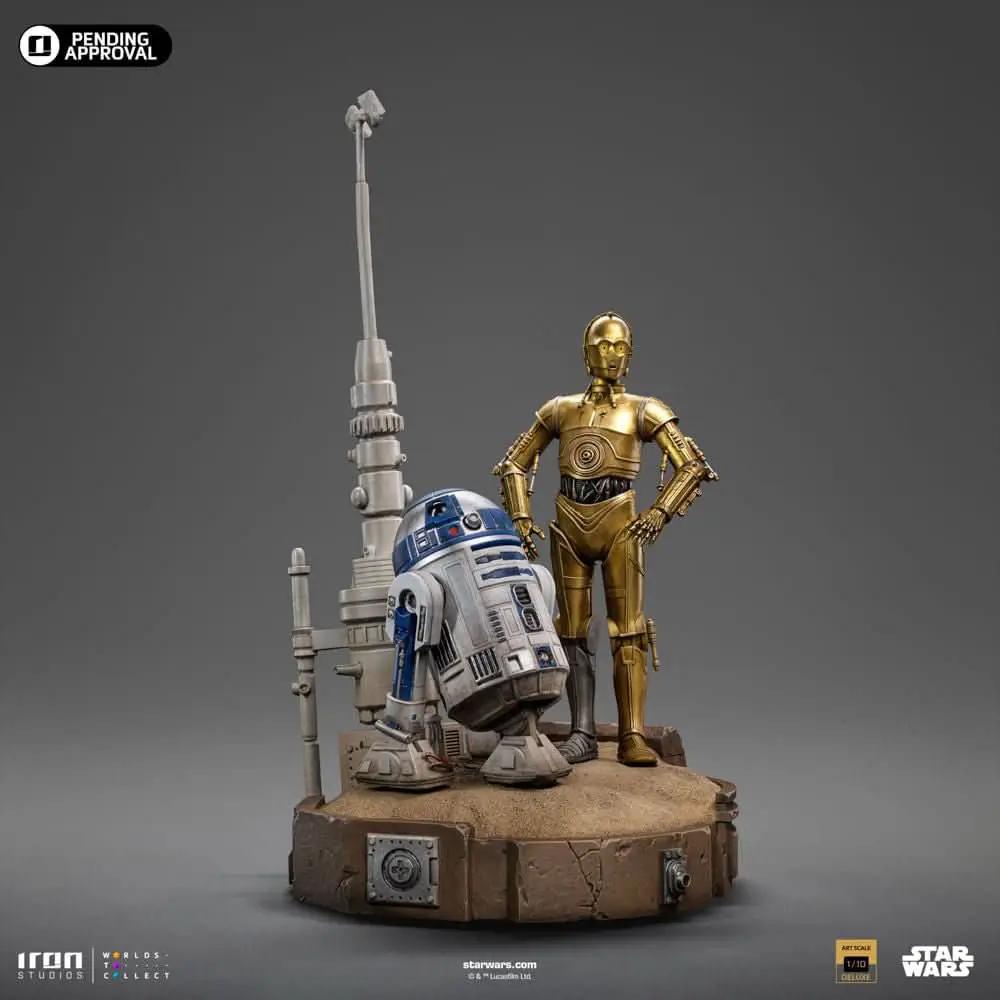 Star Wars Art Scale 1/10 statue pair: C-3PO (gold) and R2-D2 (blue-silver) by Iron Studios on a desert diorama base