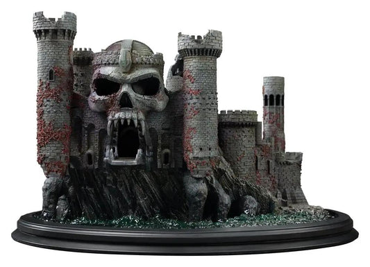 Grayskull Castle replica playset by Iron Studios, gray stone fortress with skull entrance on a black base.