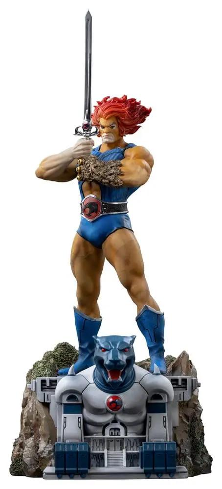 ThunderCats Lion-O statue 1/10 scale by Iron Studios; blue outfit, sword raised on rocky base with cat-like sculpture.