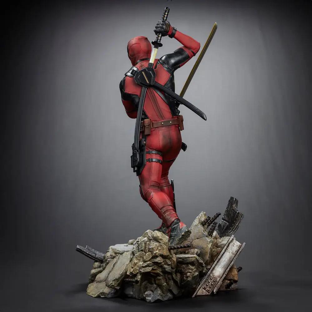 Deadpool statue by IRON STUDIOS, 1/4 scale Legacy Replica, red and black suit with swords on rubble base