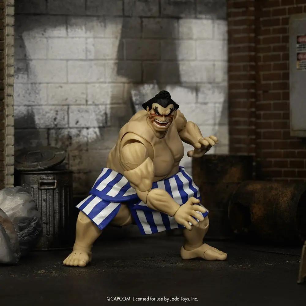 Figura de acción E. Honda 16 cm (1/12) de Jada Toys, con shorts azul y blanco rayados.