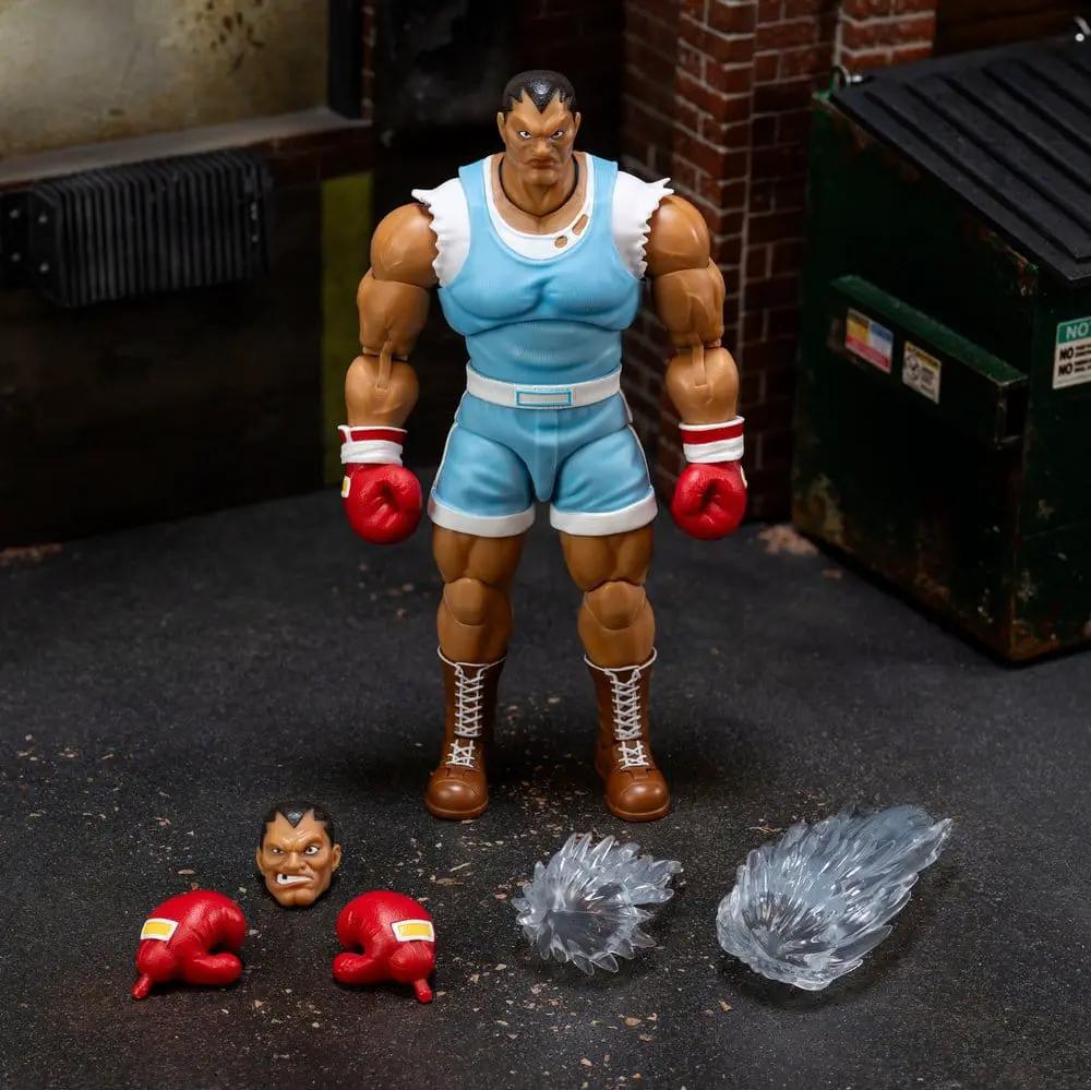 Balrog 1/12 action figure by Jada Toys, 17 cm; blue outfit, red gloves, with 2 extra fists and 2 blast effects