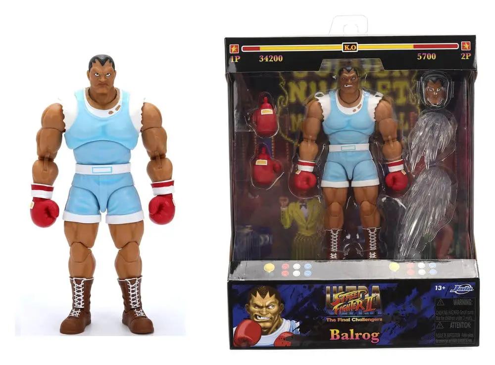 Balrog action figure by JADA TOYS; blue shorts, red boxing gloves, brown boots, 2 figures shown loose and boxed.